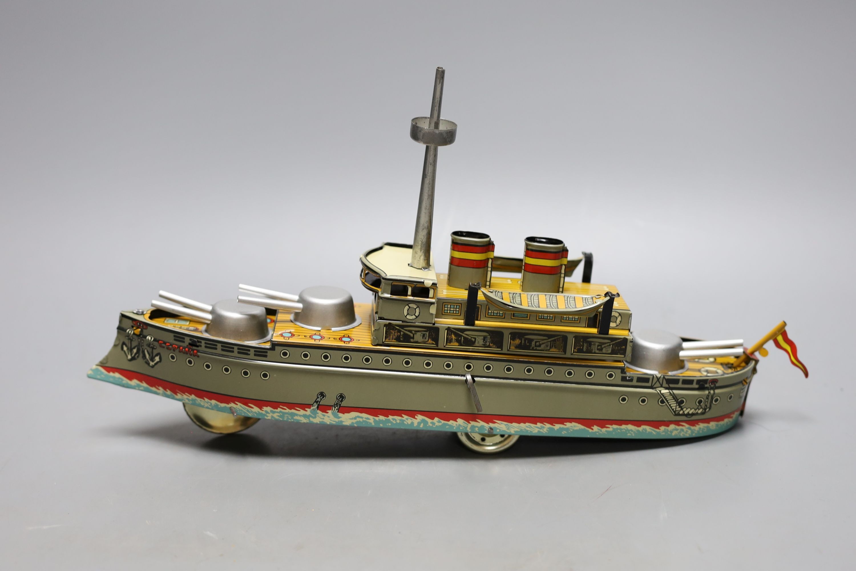 Three IBA tinplate boxed toys, two boats and a train, largest boat 42 cms wide.
